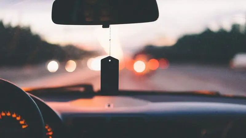 Driver's view of traffic lights from a car dashboard at night — Uber and Lyft accident claims in New Britain, CT